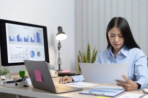 An image showing a business owner preparing for VAT registration UK