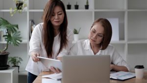 An image showing a small business owner considering VAT registration UK